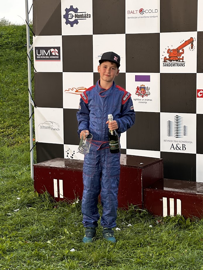 Young Deniss on podium